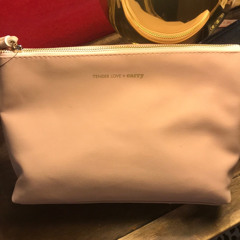 Adorable pale mauve make up bag or roomy clutch. Interior compartments. Cute!